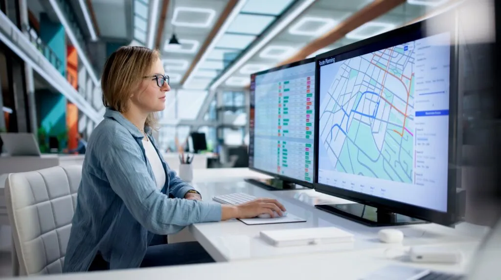 Route dispatcher working at computer