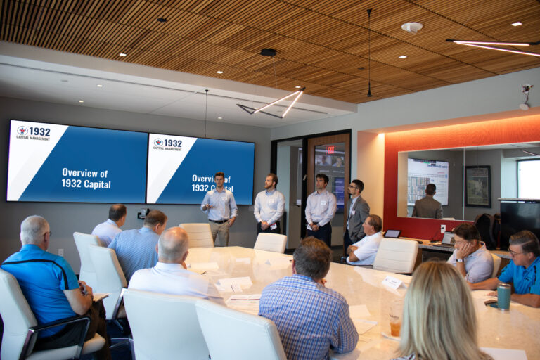 Group of people presenting in meeting